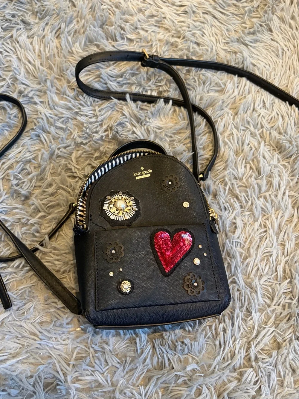kate spade black mini backpack with red sequin heart and floral studs